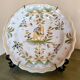 Antique Moustiers plate hand-decorated with a horseman.