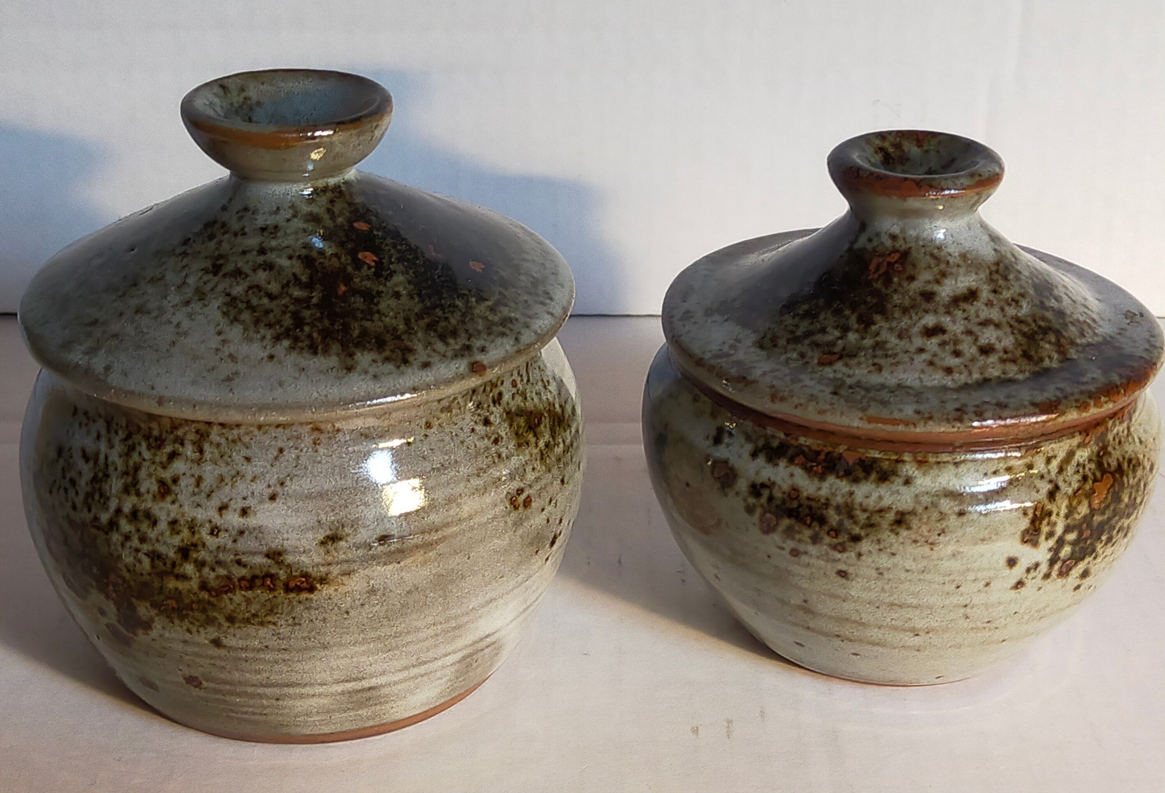 Duo of potter's pots covered in vintage glazed stoneware