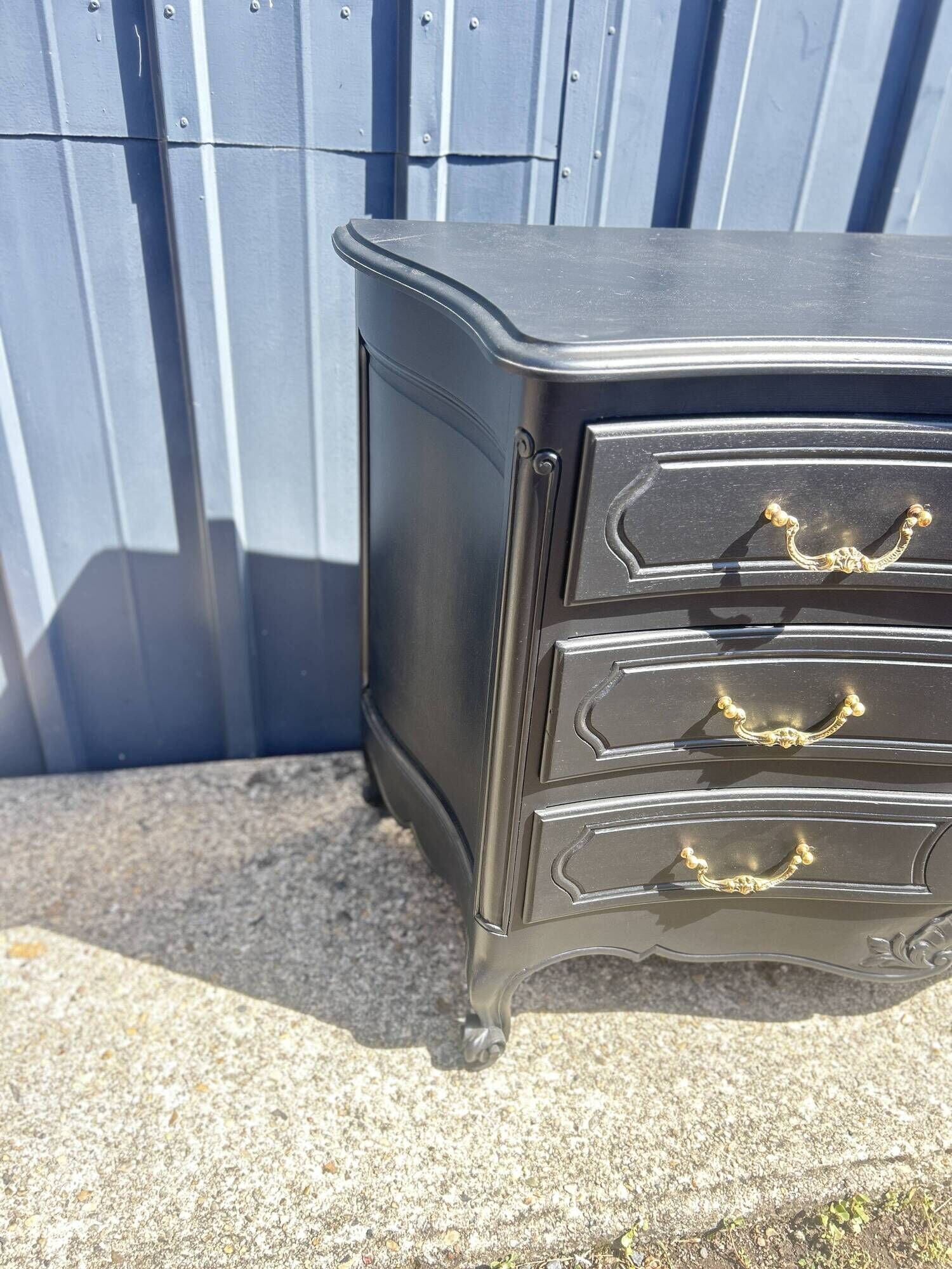 Louis XV style black lacquered chest of drawers with four drawers.