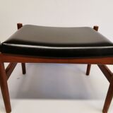 Danish designed footstool, in teak and black skai. Made at Spøttrup furniture factory in the 1960s.