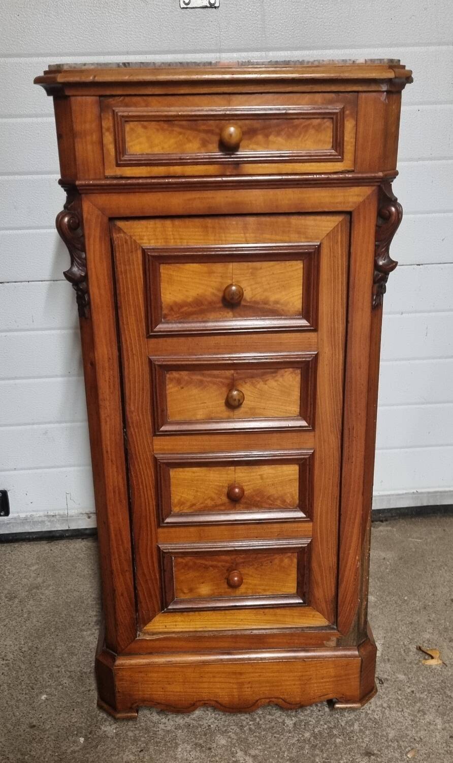 Cherry nightstand with pink marble.