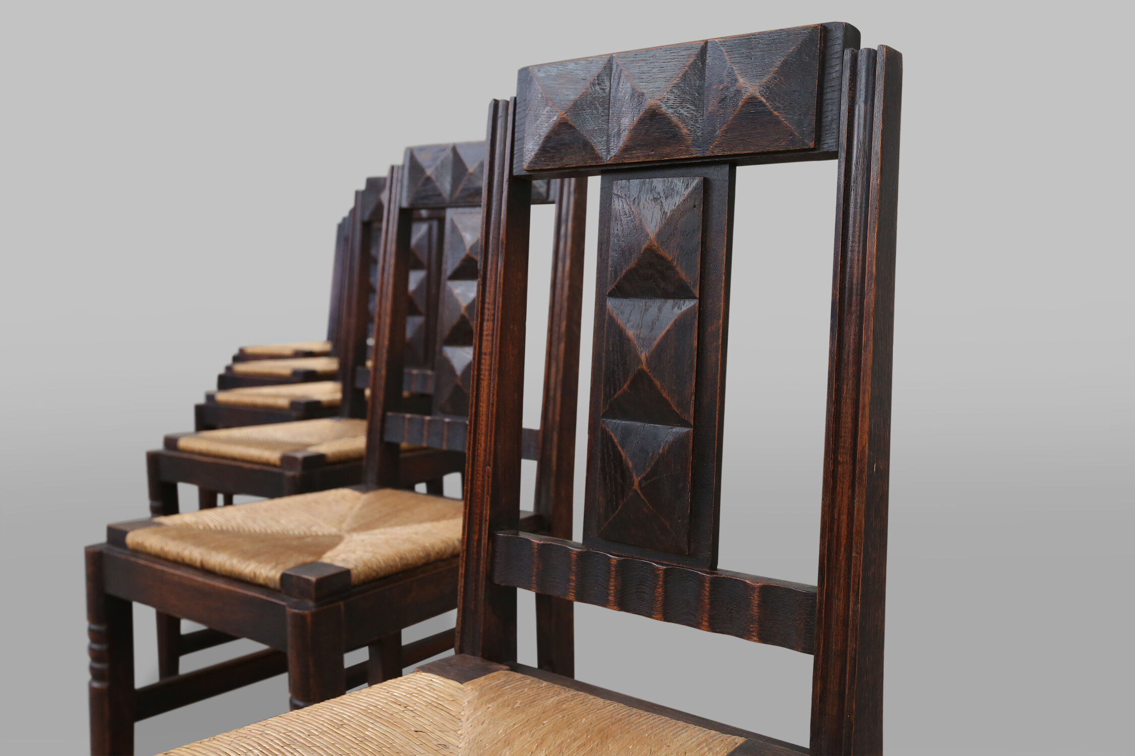 Set of six oak an wicker dining chairs by Victor Courtray