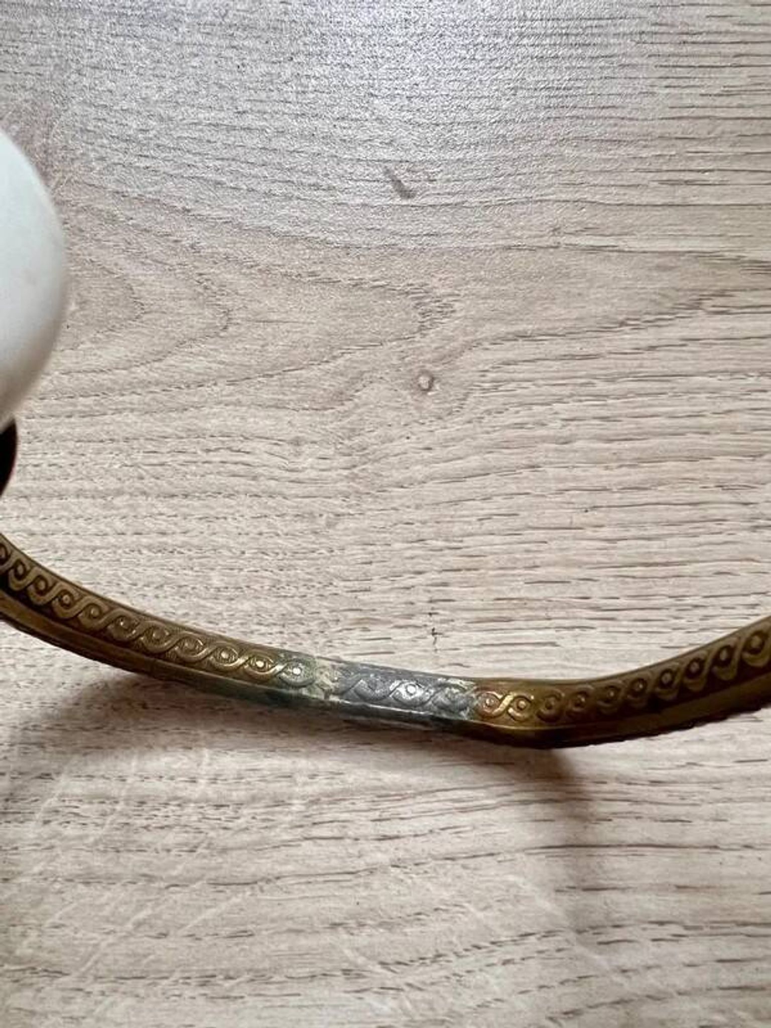 Vintage brass coat hook with ivory-style knob