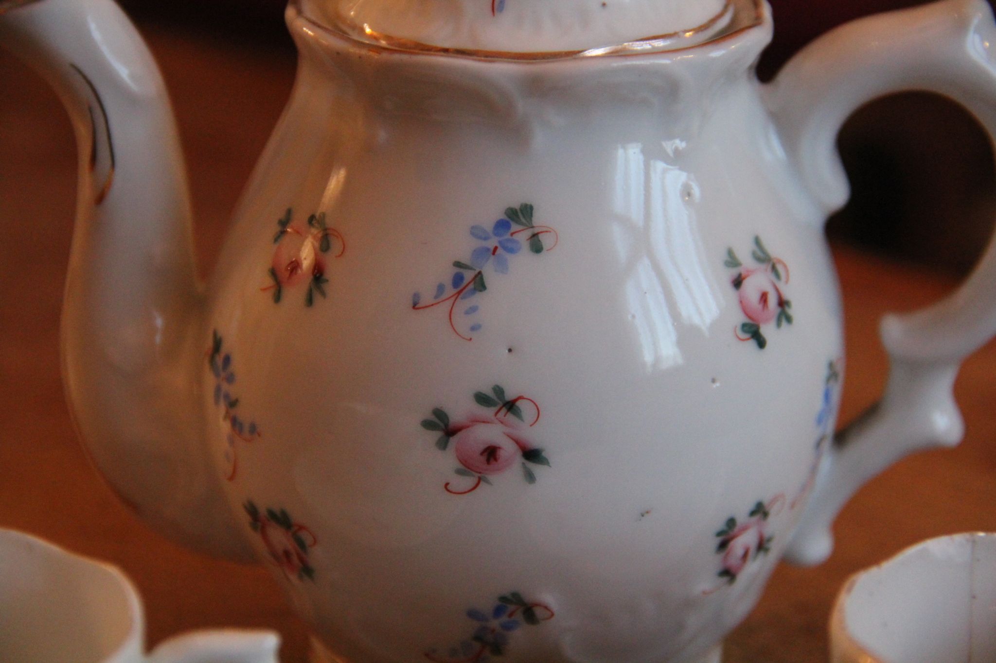 Hand-painted floral porcelain mocha service