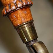 High Victorian leather tête-à-tête canapé with a walnut burr chessboard.