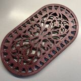 Old cast iron table mat
