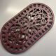 Old cast iron table mat