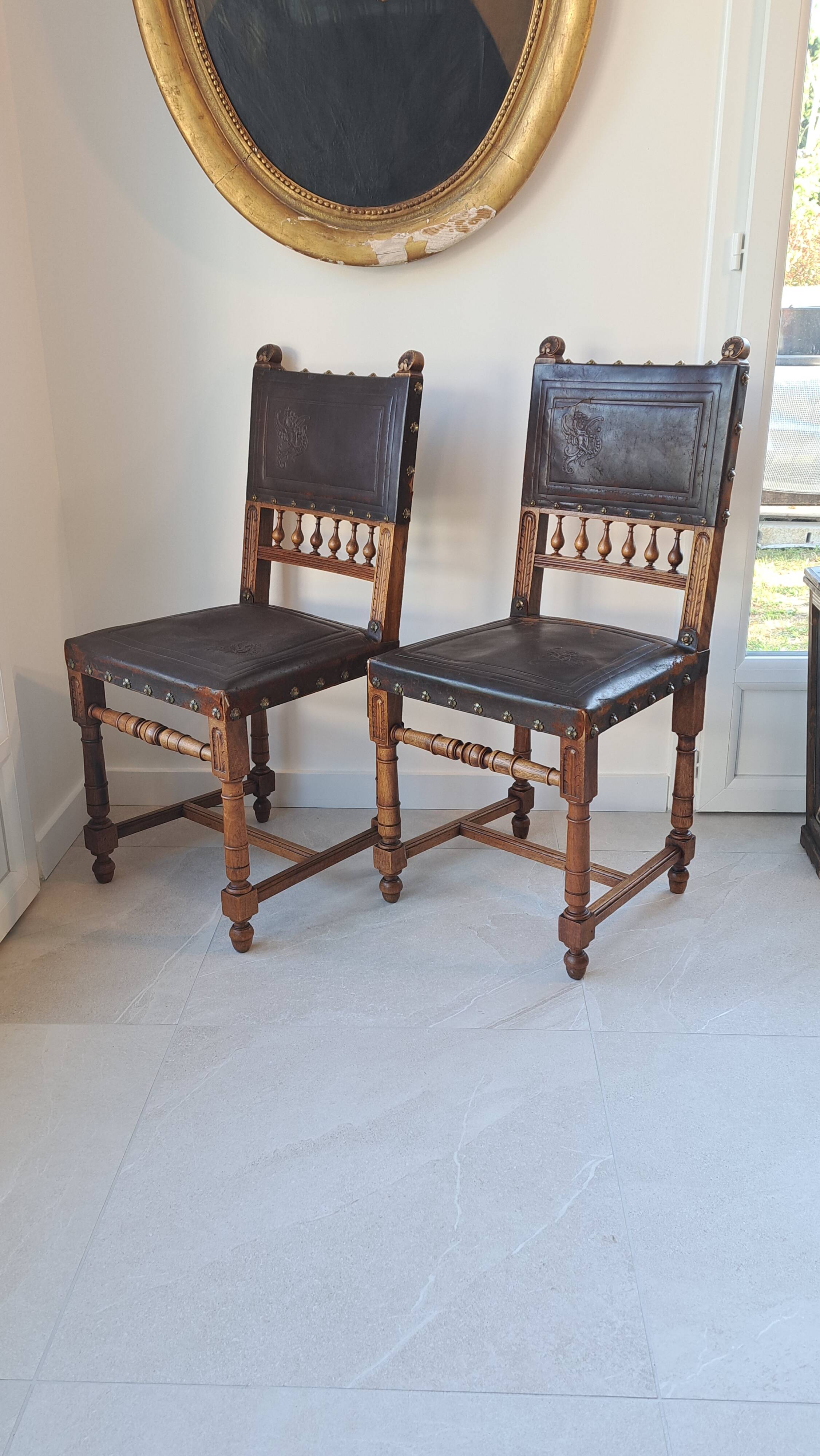 Pair of antique chairs in embossed leather, Henri II style.