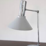 Chrome metal desk lamp and gray articulated arm