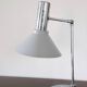 Chrome metal desk lamp and gray articulated arm