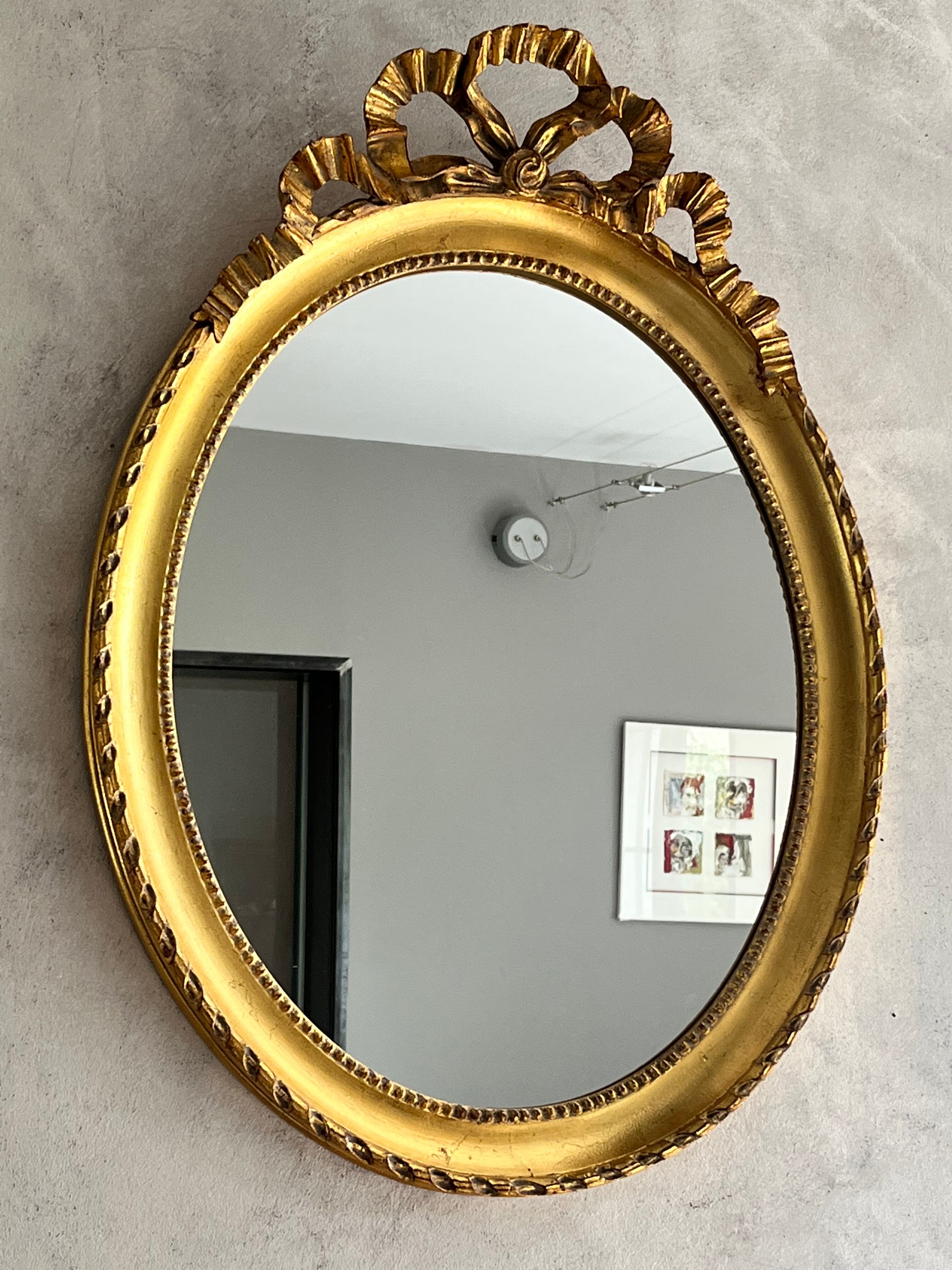 Gilded mirror with pediment