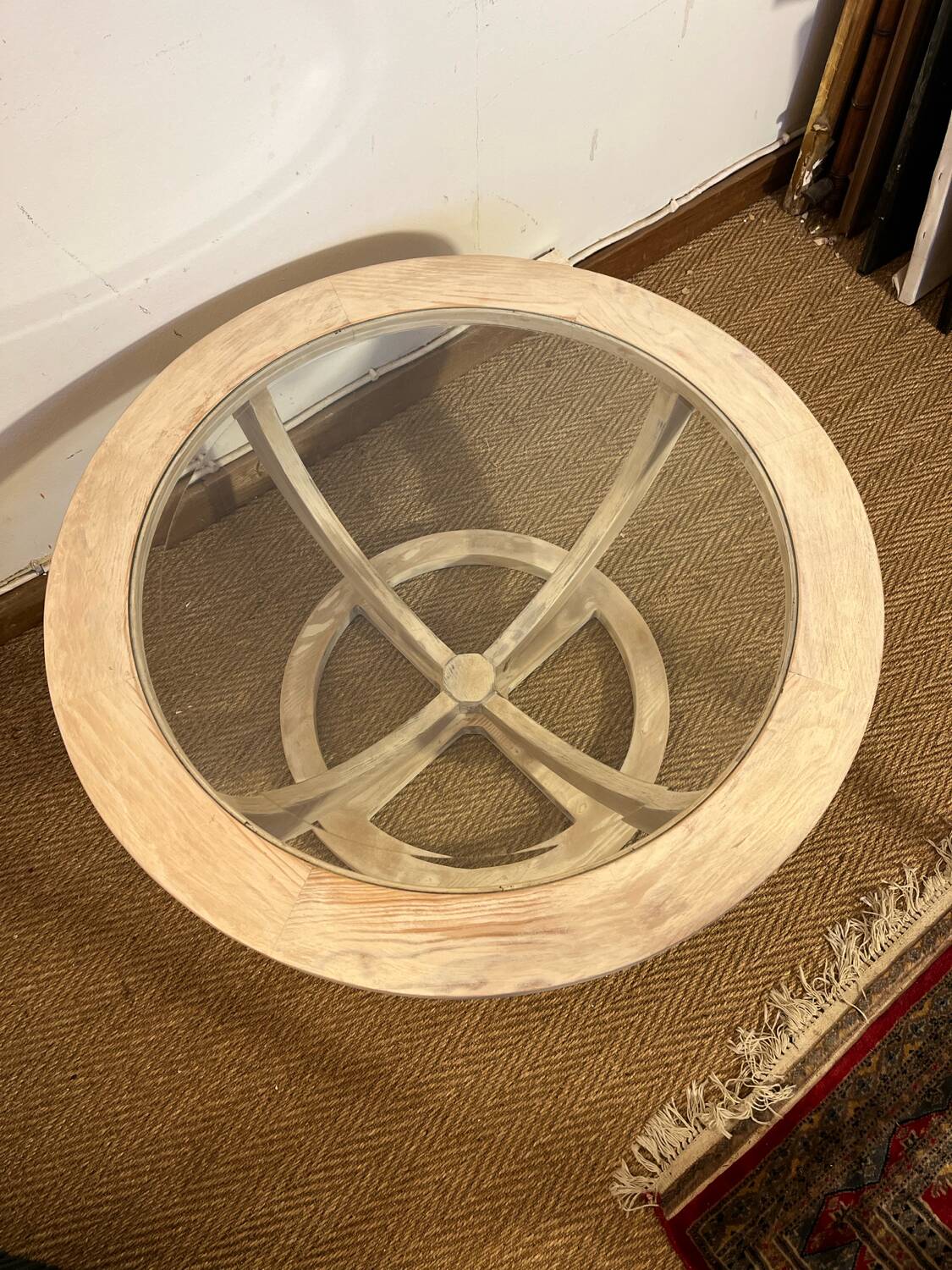 Oval patinated wood and beveled glass coffee table