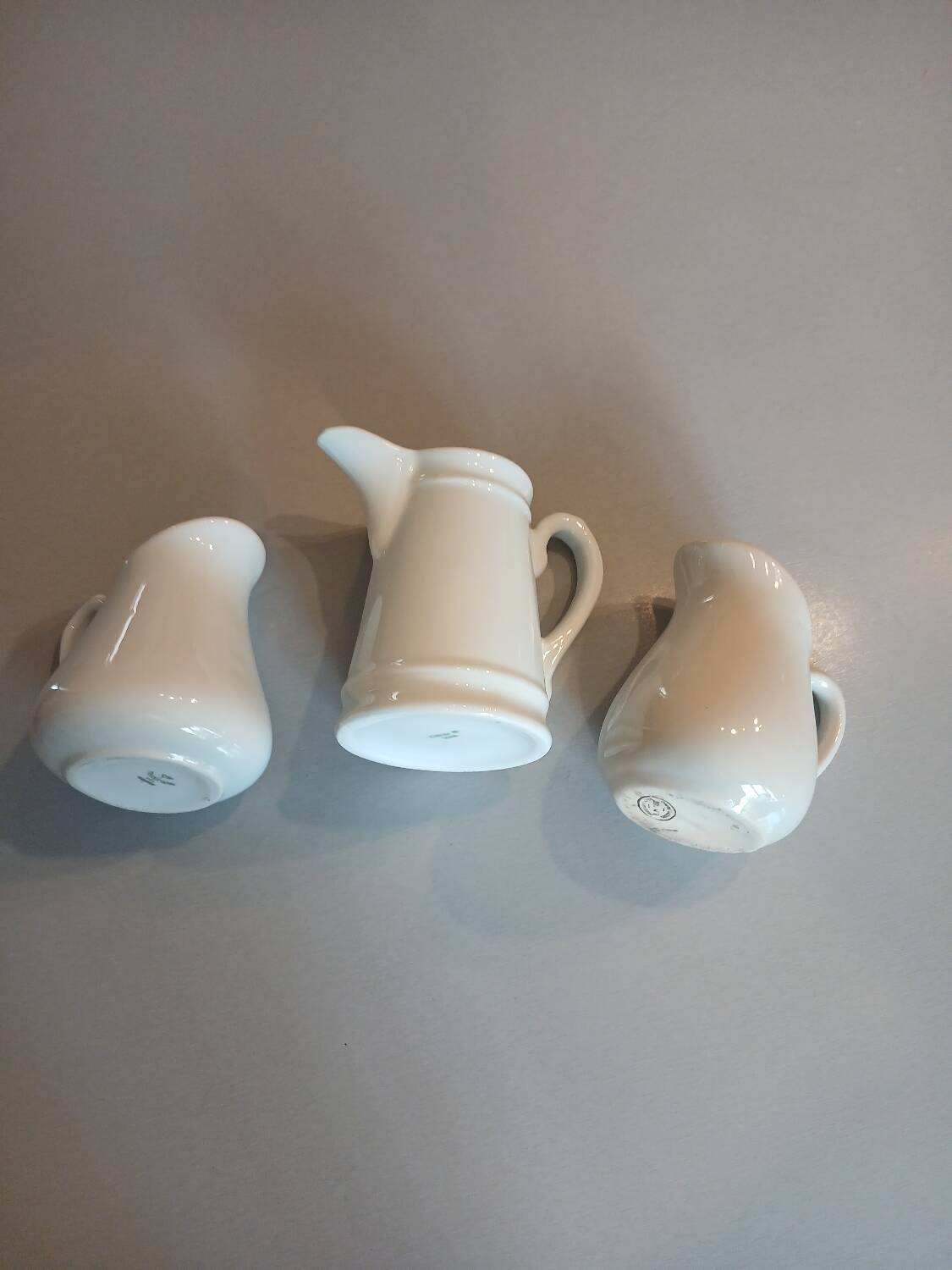3 small antique porcelain pitchers/milk pots