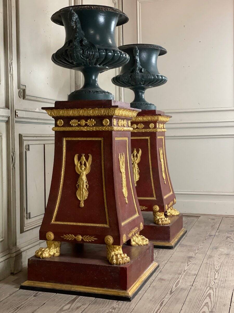 Pair of plaster bases imitating porphyry and gilded bronze circa 1980.
