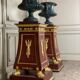 Pair of plaster bases imitating porphyry and gilded bronze circa 1980.