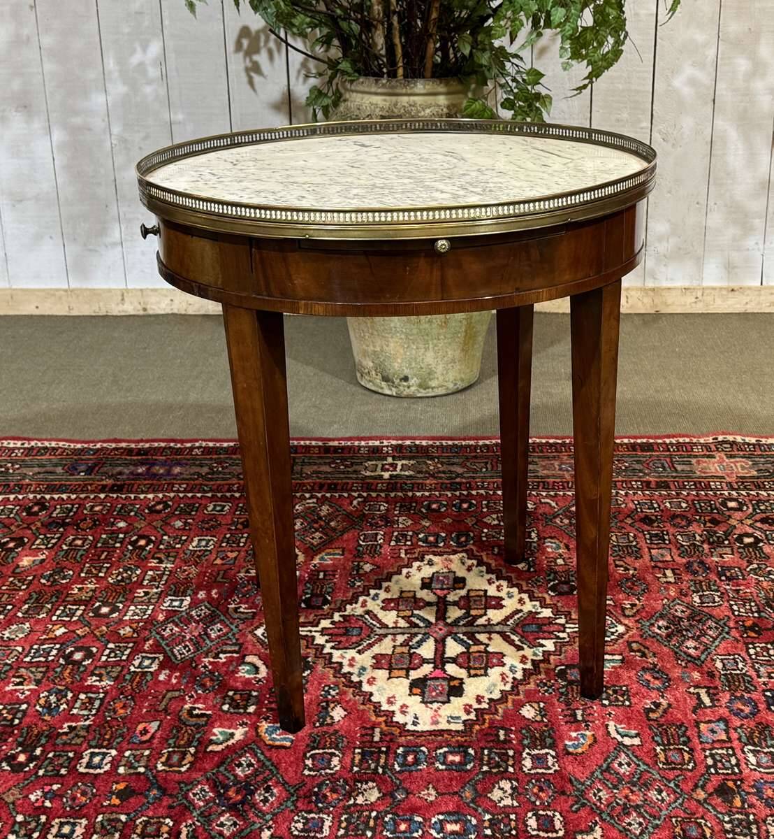 Louis XVI style bouillotte table in mahogany with a white marble top.