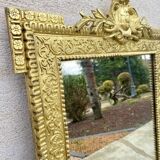 19th-century antique mirror in carved gilded wood, Napoleon style.