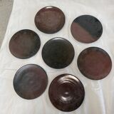 Series of 7 brown ceramic plates