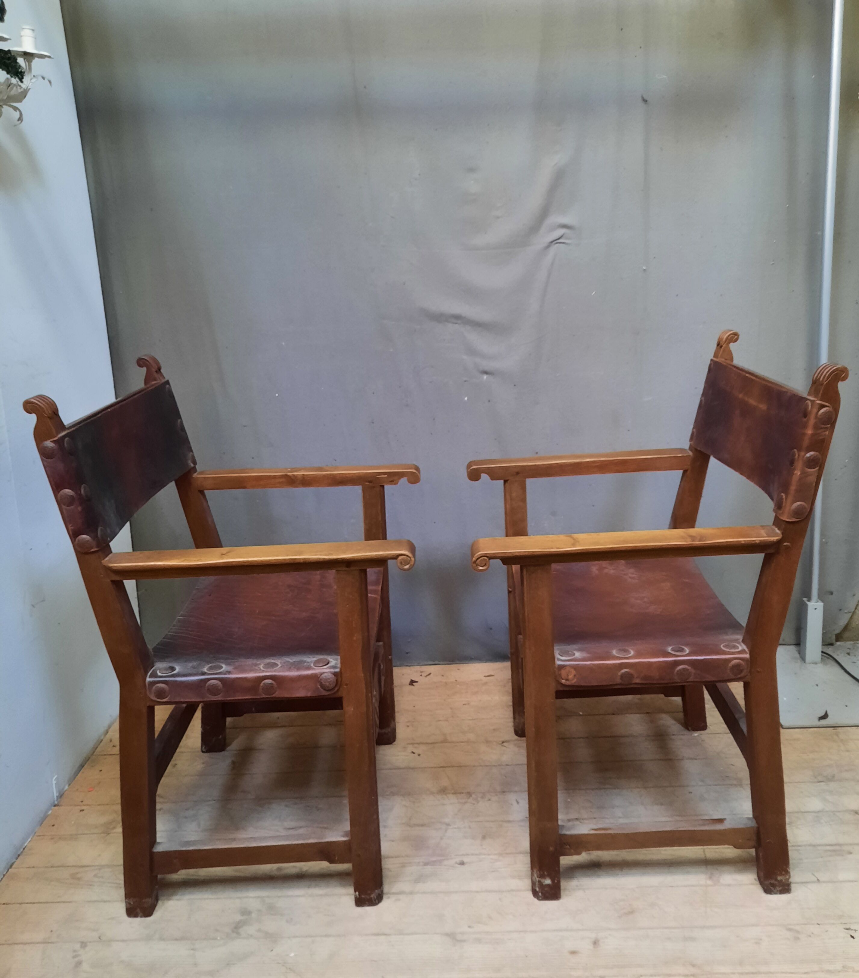 Pair of medieval leather style armchairs