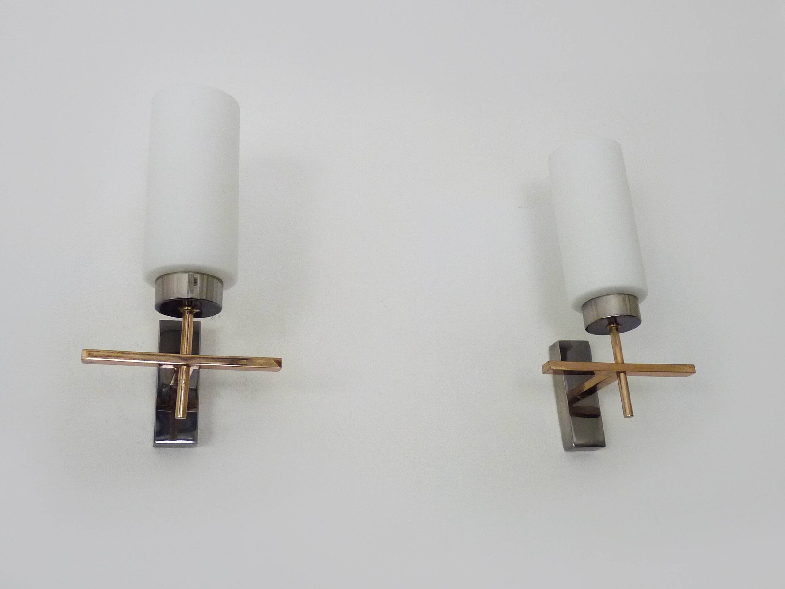 Pair of chrome-plated metal and opaline brass wall lights. 1960s