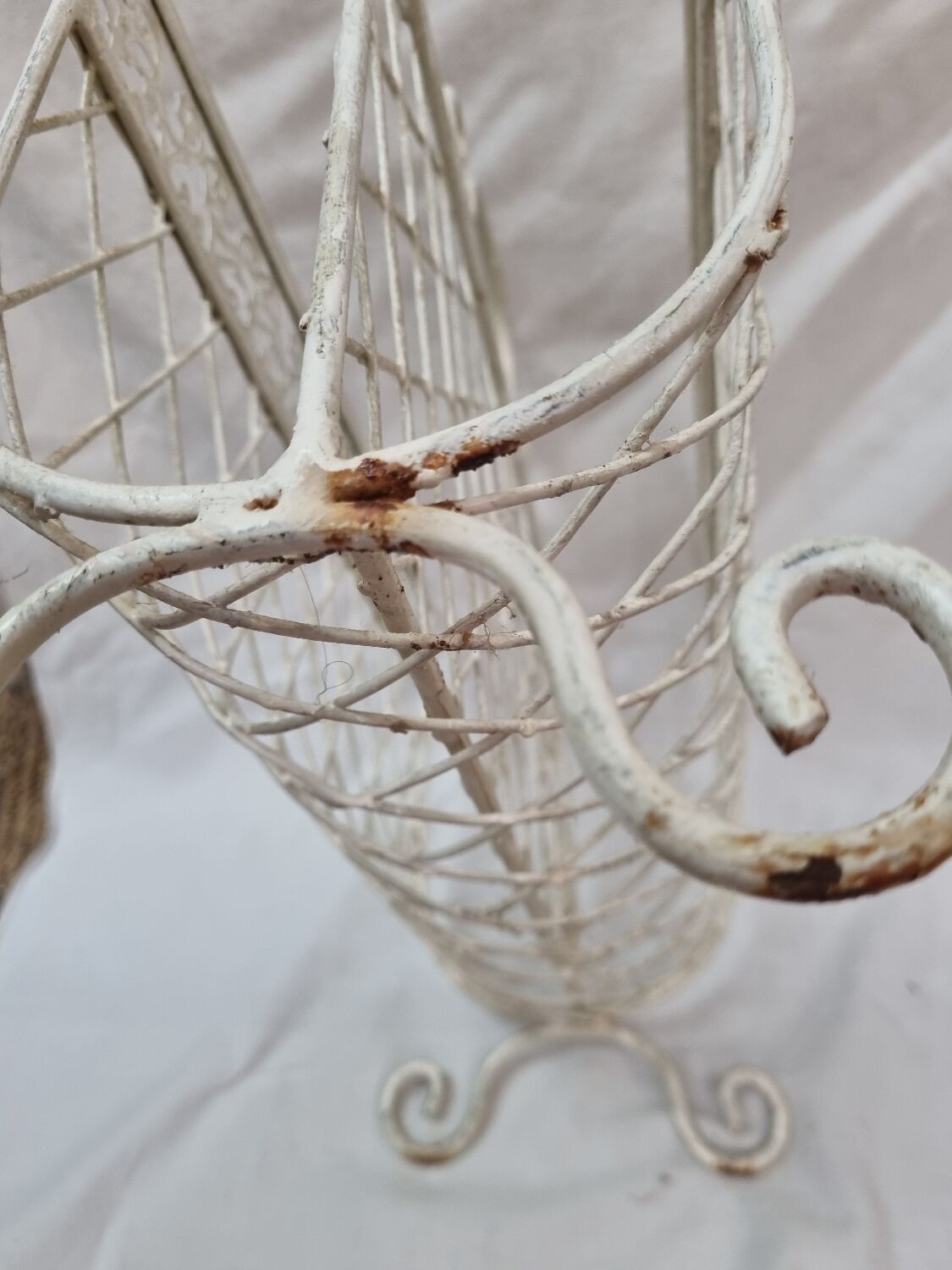 White wrought iron magazine holder