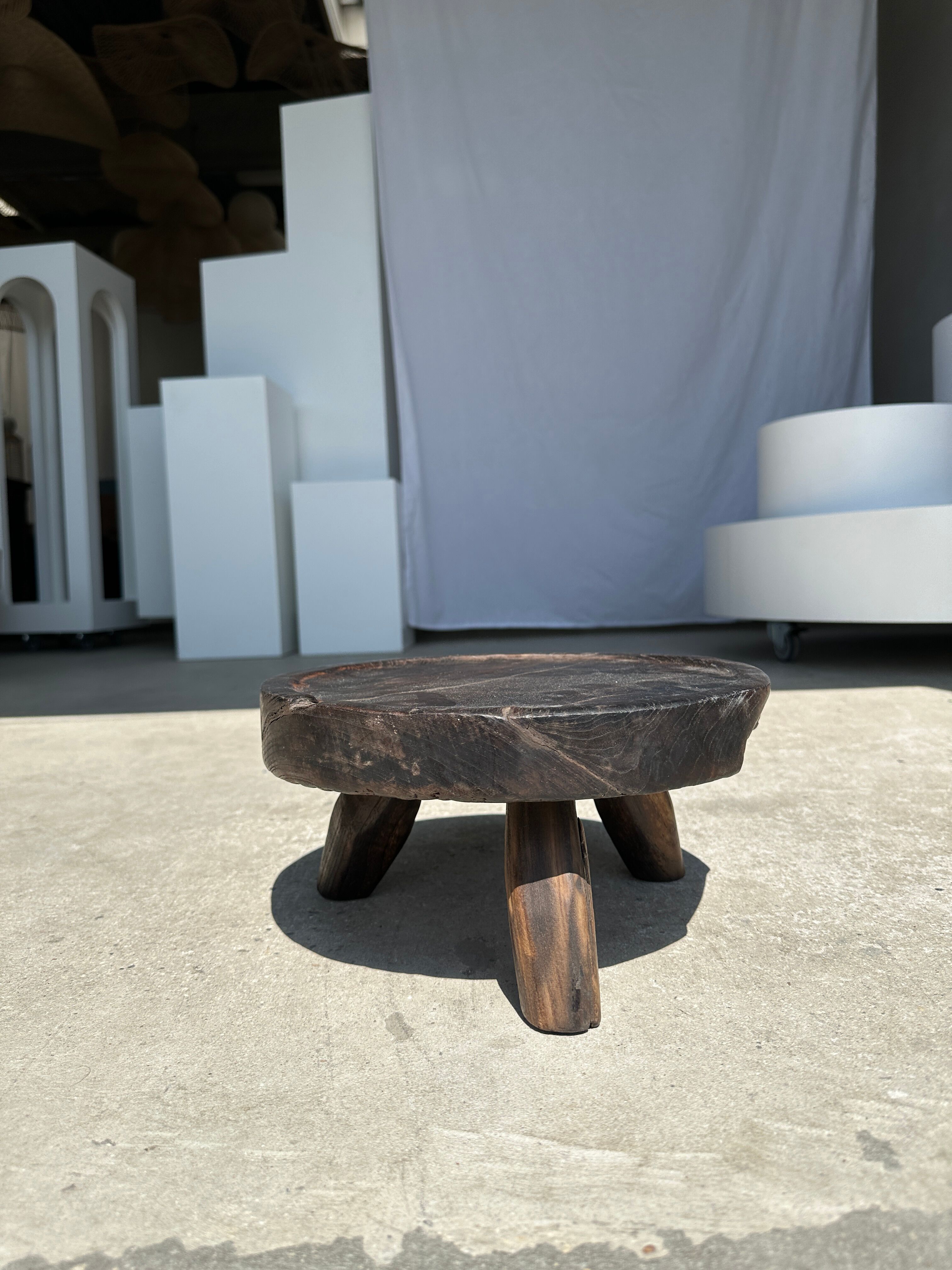 Small tripod stool low in dark brown upcycled teak