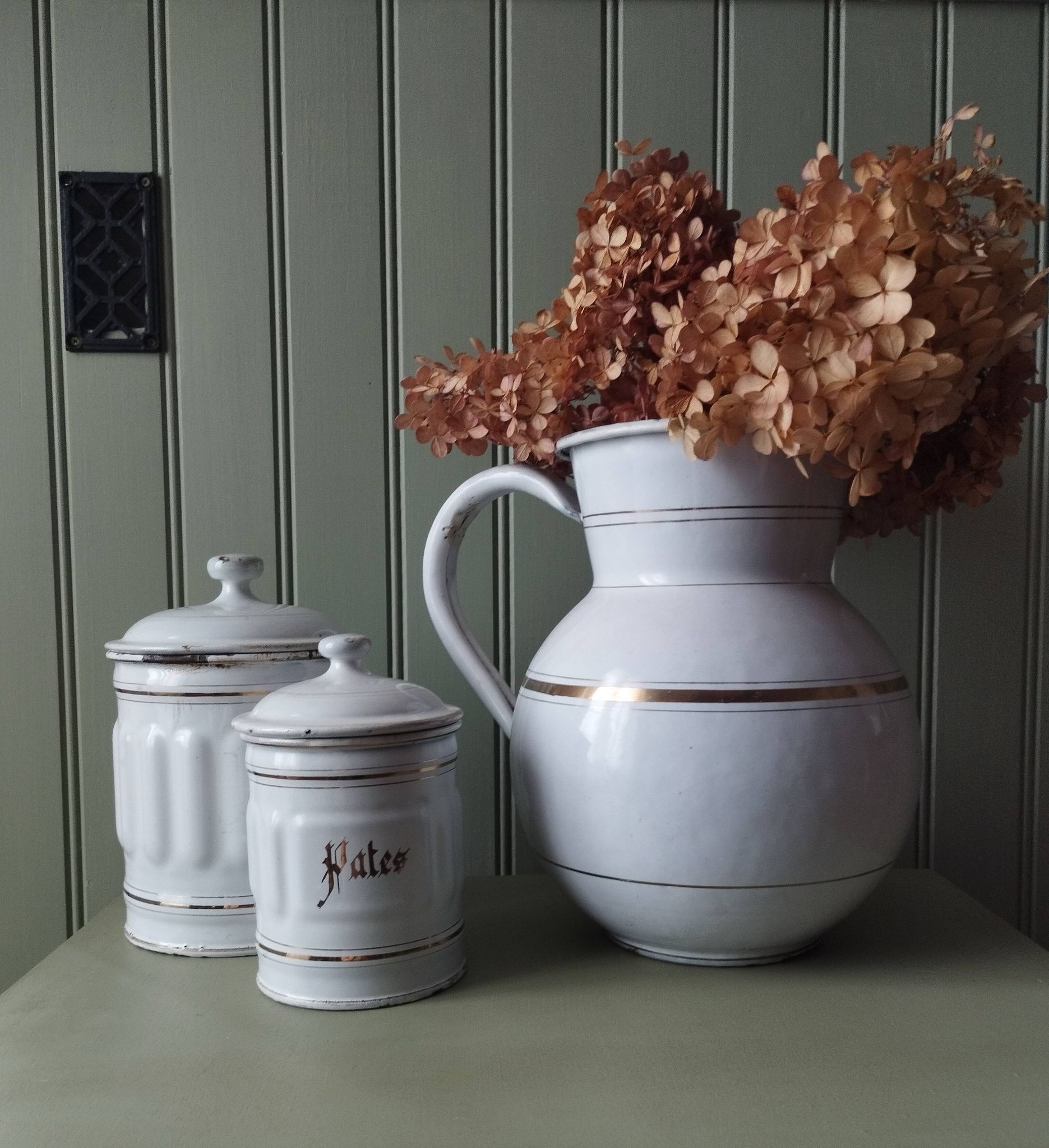Rare large, pot-bellied toilet jug in white enamelled sheet metal with gold edging