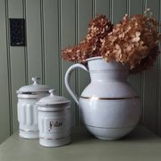 Rare large, pot-bellied toilet jug in white enamelled sheet metal with gold edging