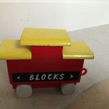 Small vintage train in multicolored wood