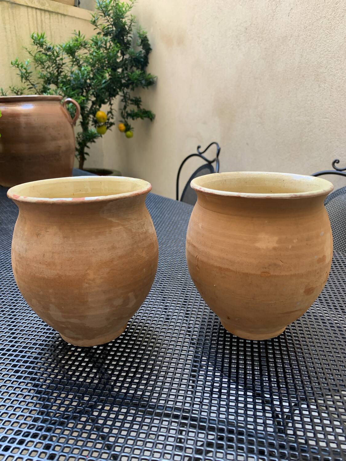 Pair of terracotta and ceramic pots
