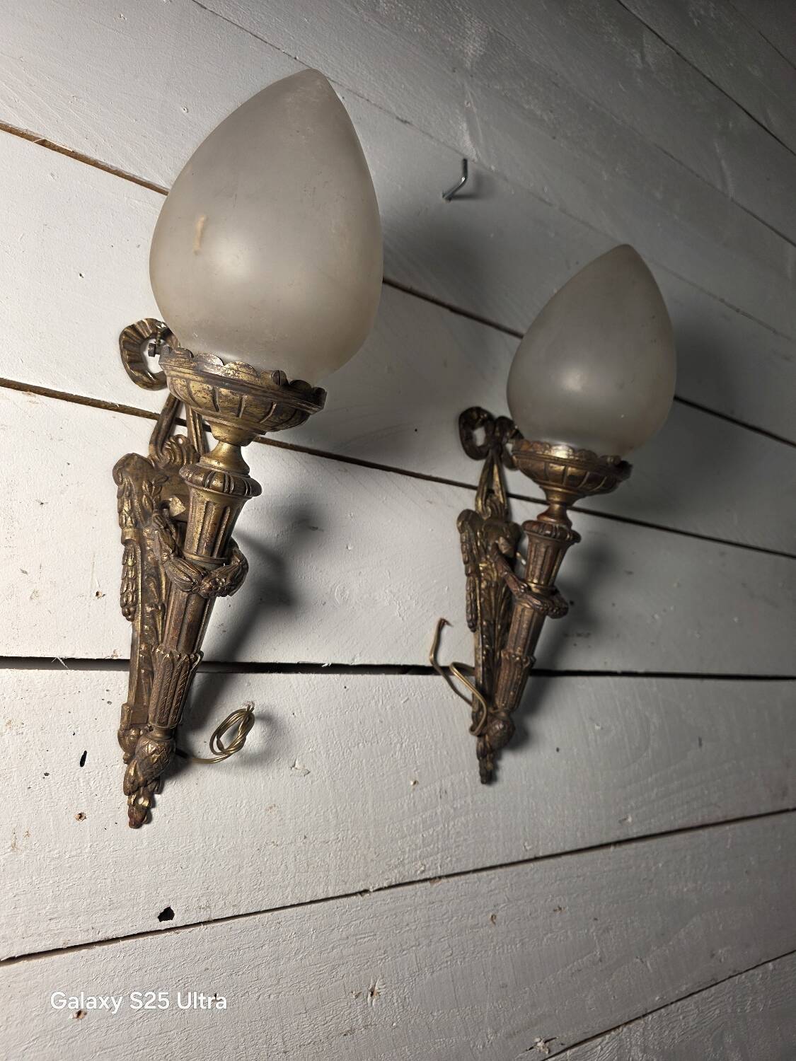 Pair of torch wall lights in Louis XVI style in 19th-century bronze.