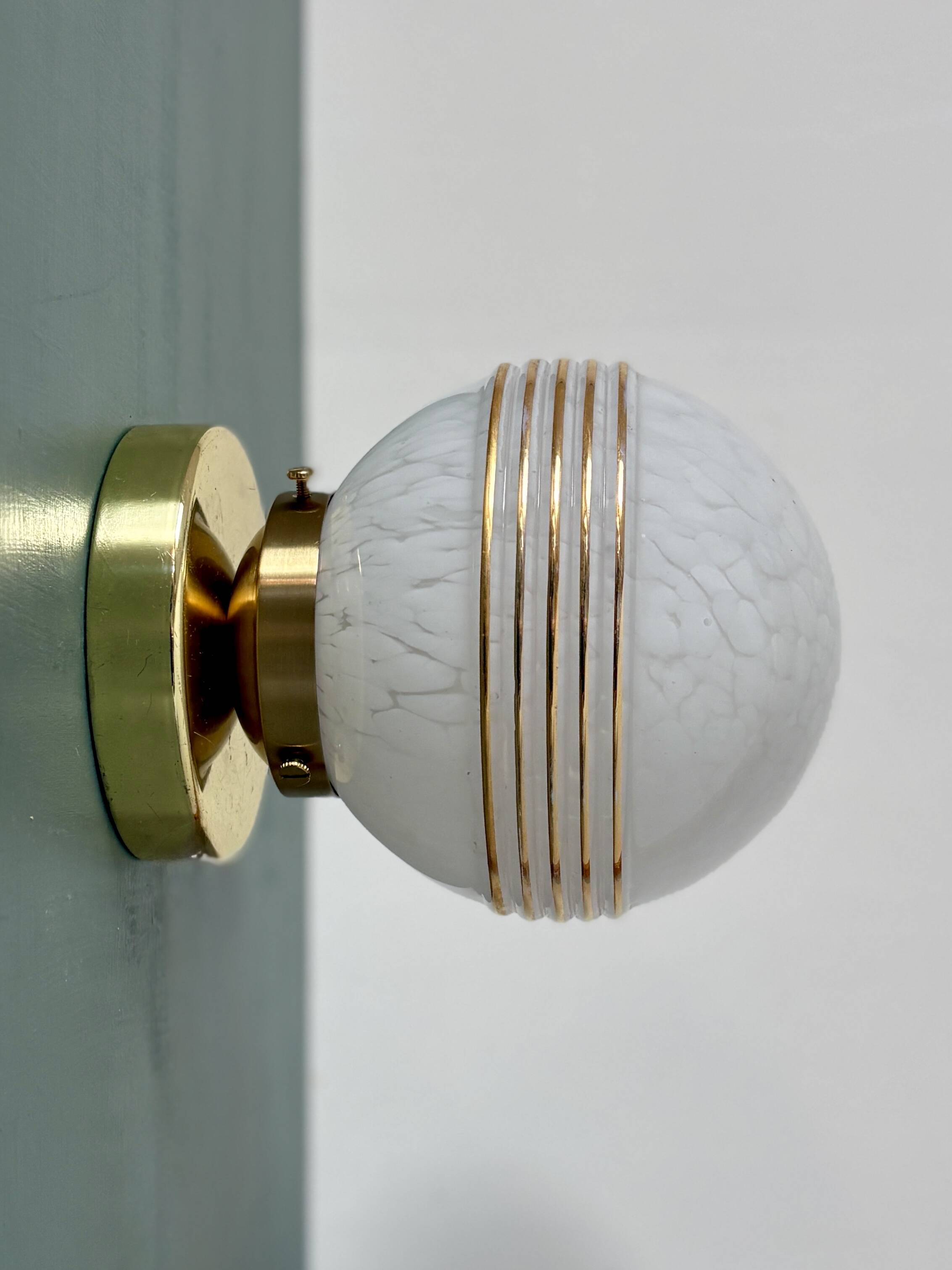 Vintage glass globe wall or ceiling light in white and gold from Clichy.