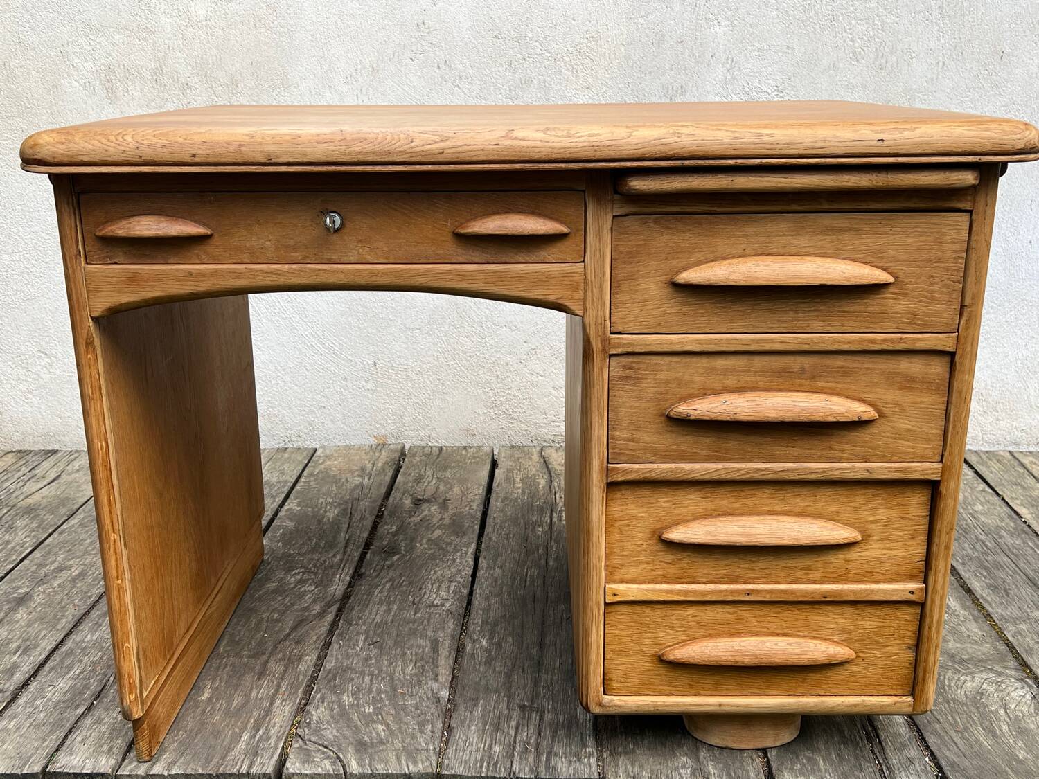 Antique light oak desk from the 1950s with 4 drawers