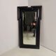 Late 19th century ebonised mirror with original foxed glass