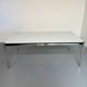 Large table design USM Haller with a white top and chrome structure.