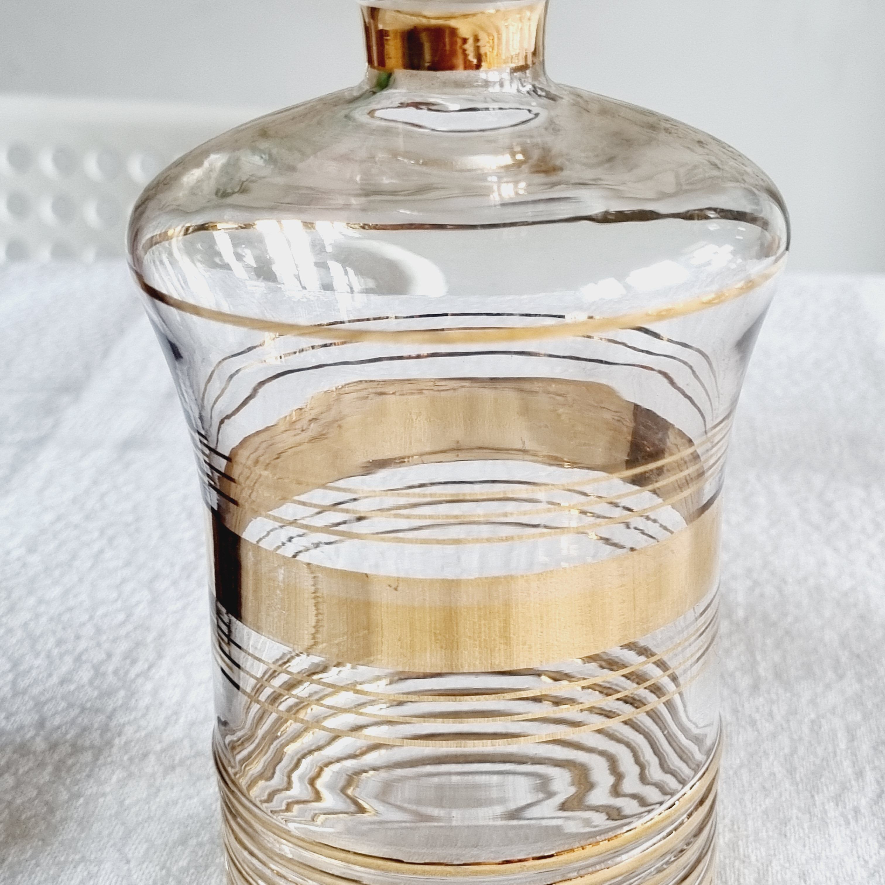 Blown glass decanter with golden borders