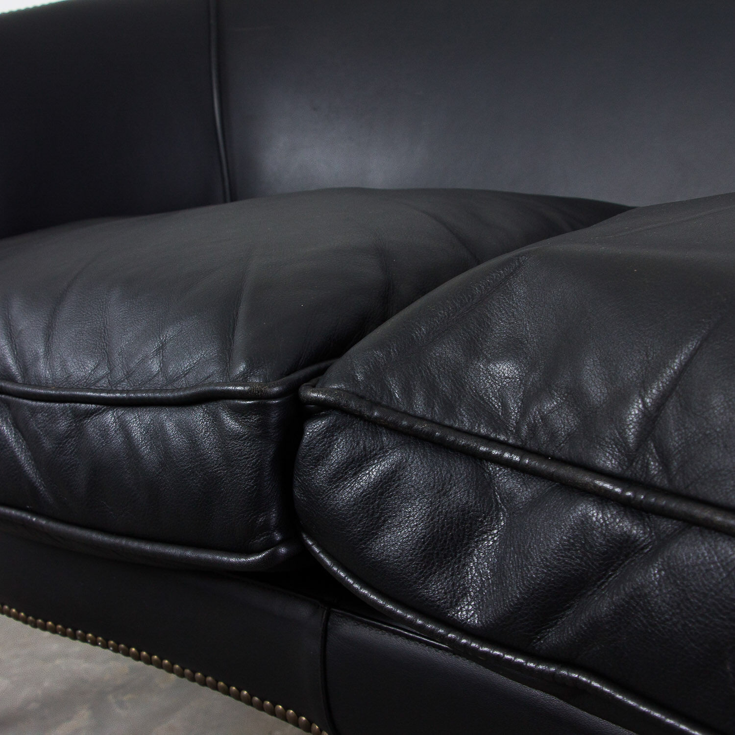 Black leather club sofa