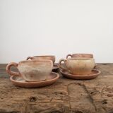 Stoneware cups with saucers