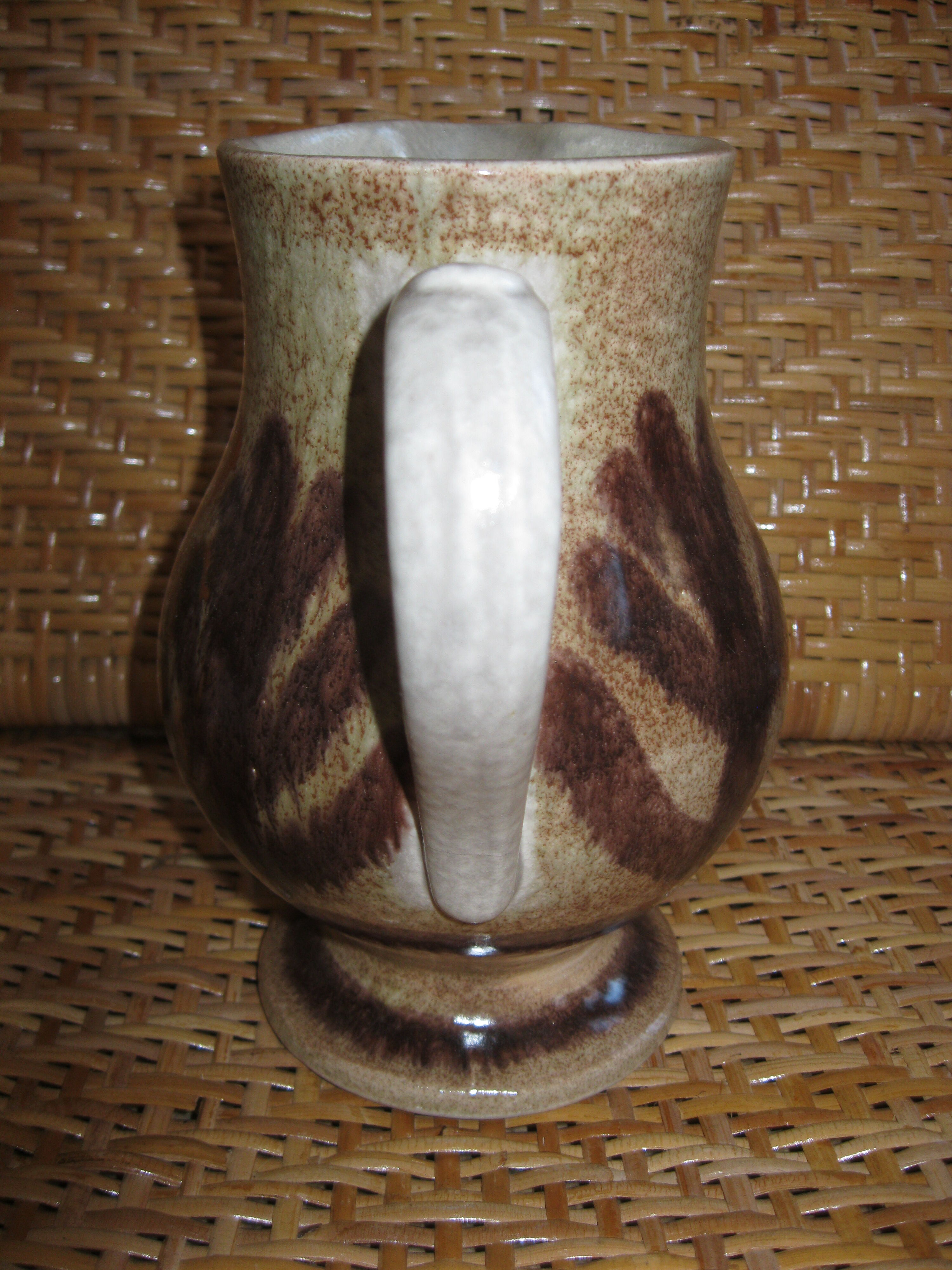 Glazed stoneware jug with hand decoration