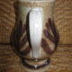 Glazed stoneware jug with hand decoration