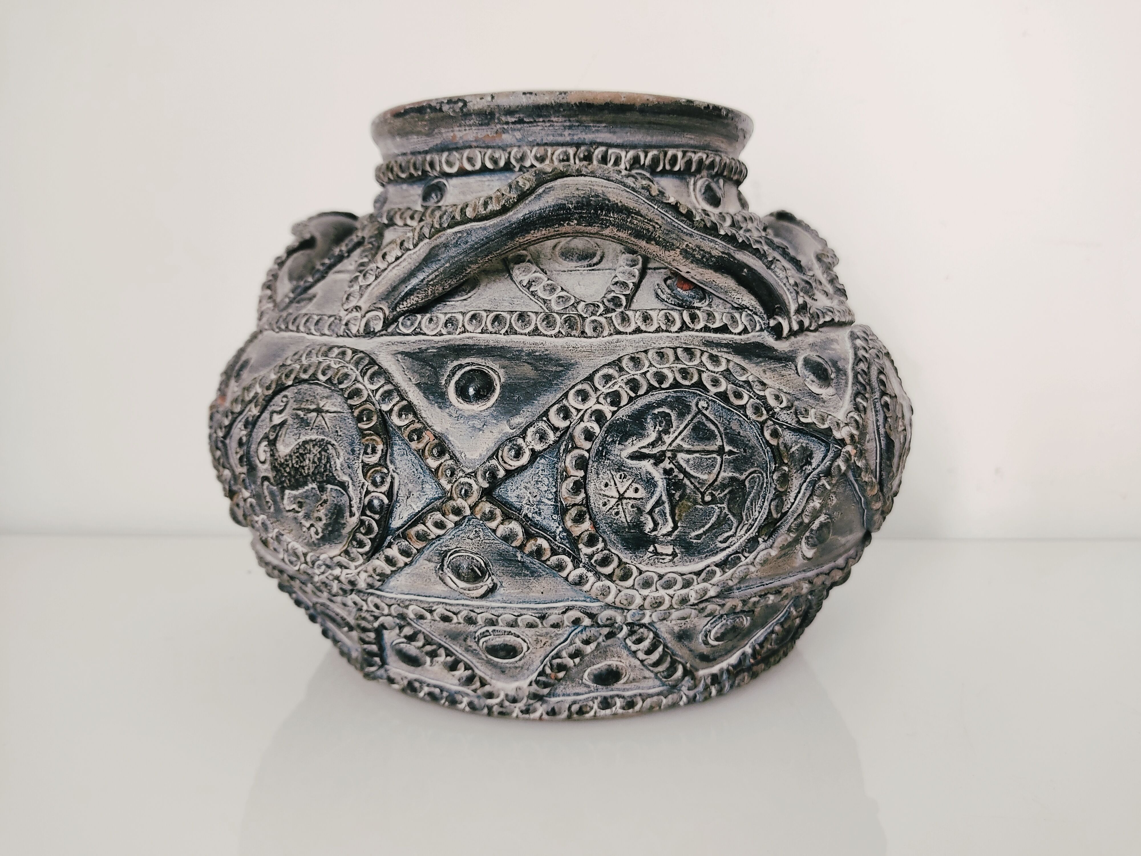 Terracotta vase with decoration astrological signs