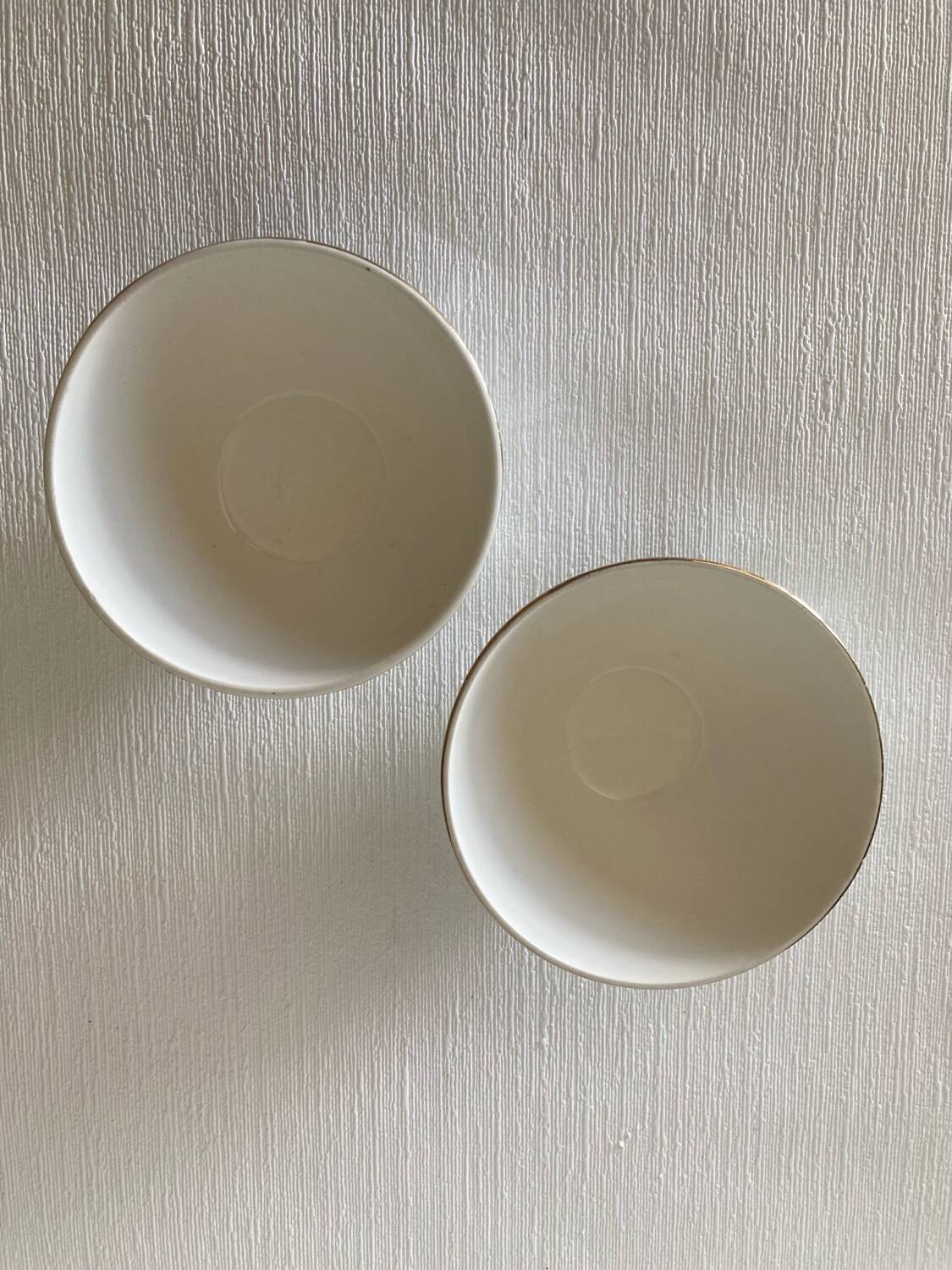 Pair of small faceted bowls with cow illustrations from the 40s and 50s