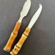 Bamboo handle cheese knives.