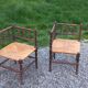 Pair of angled armchairs with turned wood and rush seats from the 1960s.