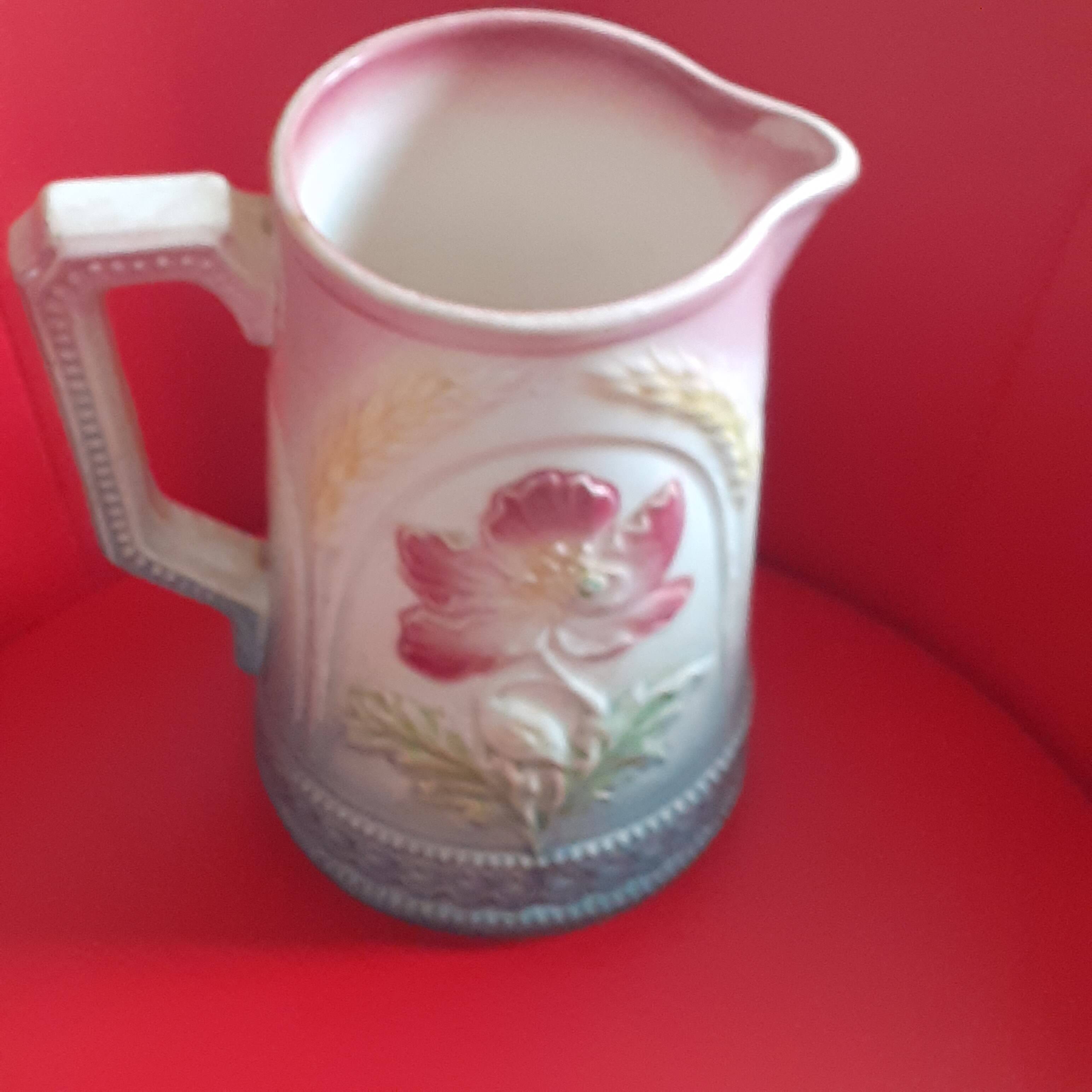 Antique Liongchamp slip pitcher. Flowers.