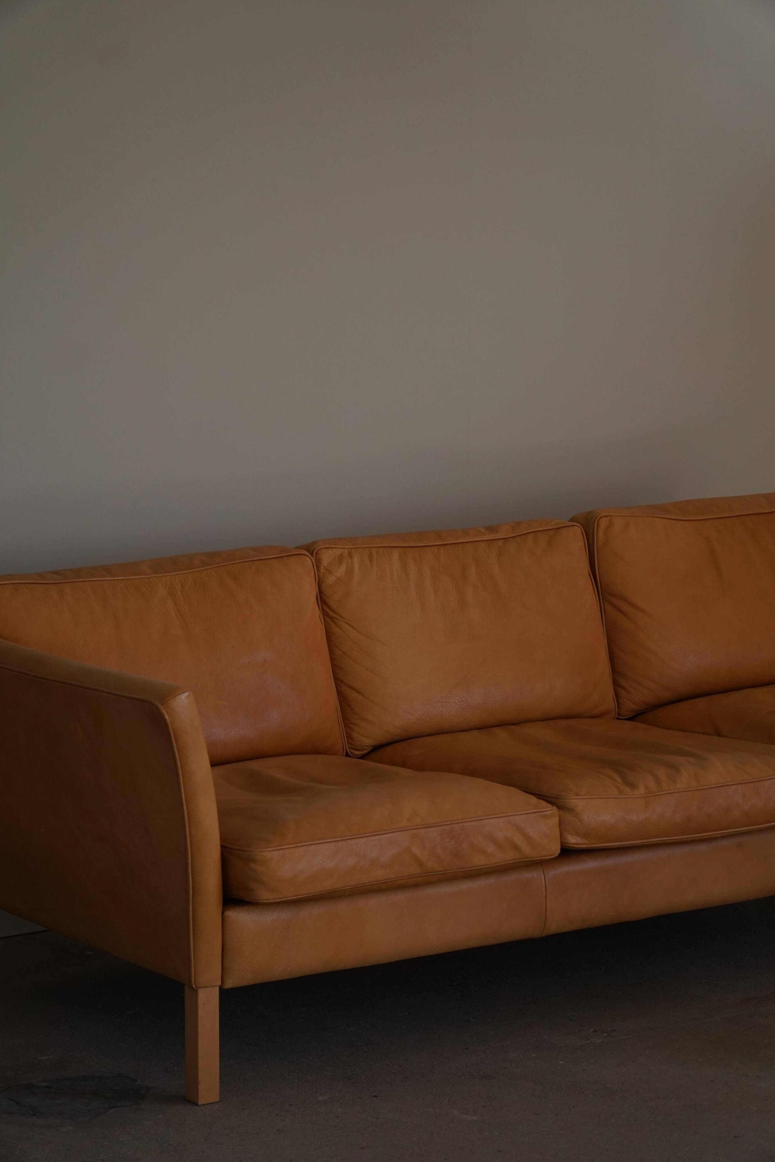 Danish Midcentury 3-seater canapé by Stouby in cognac brown leather, made in the 1970s.