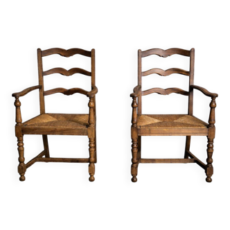 Pair of rustic antique armchairs in wood and woven straw.
