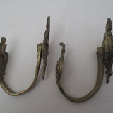 Pair of embraces in brass or bronze
