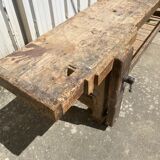 Old carpenter's workbench with press