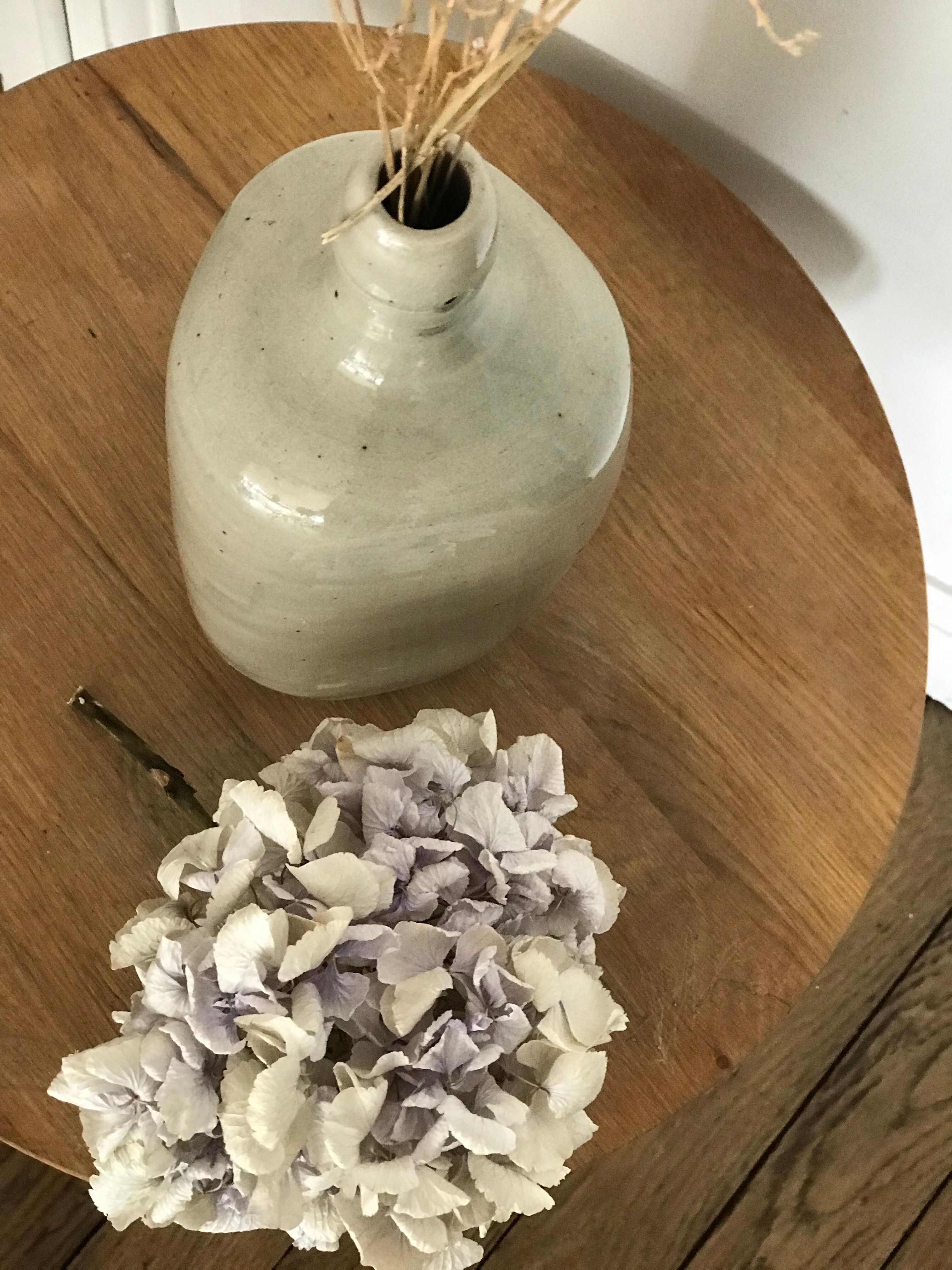 Old light grey ceramic bottle